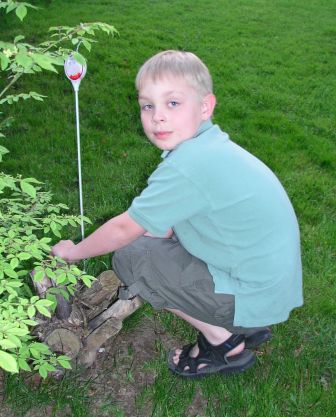 Jeffery plants his Arbor Day tree