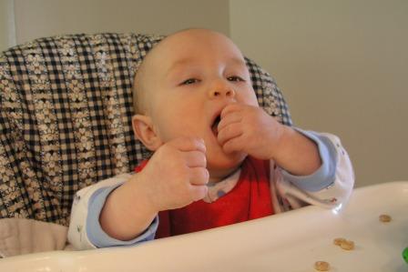 Thomas feeds himself