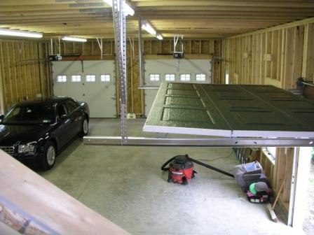 garage floor from stairs and our new tiller