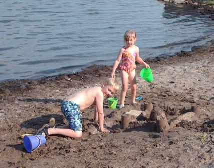 Jeffery and Bethan enjoy the sand and boat