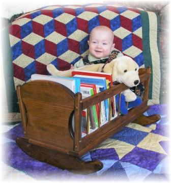 The baby doll cradle is now a book shelf!
