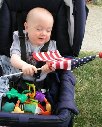 Thomas waits to see Grandpa's firetruck in the Fairport parade