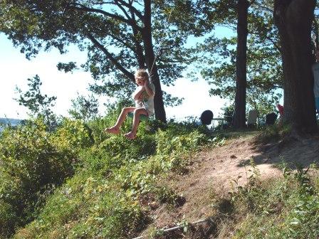 Bethan enjoys the swing over the cliff