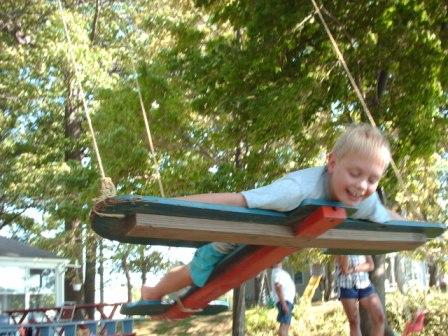 Jeffery prefers the airplane swing (at the Wall's cottage)