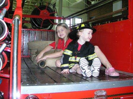 Riding in the back of a hose truck