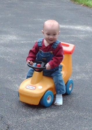 Thomas learns to "ride" on Grandpa's driveway