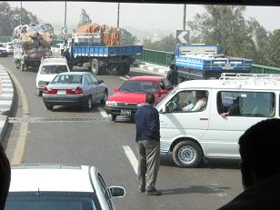 A truck that caught fire in the middle of the road caused this scene with people turning around on the freeway.