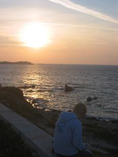 Rachel writes in her journal as the sun sets.