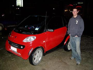 Bobby with a SmartCar.&nbsp; They actually look pretty cool, but would be toast in the states.