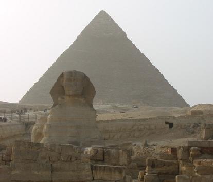Sphinx in "guarding" the pyramid of King Chefren, the second largest of the Great Pyramids of Giza.