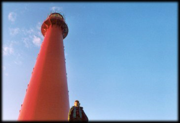 Next to lighthouse a big sun clock