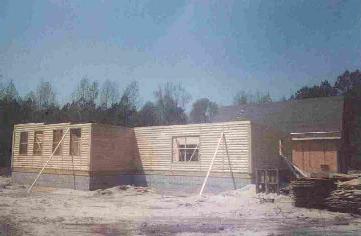 Log home construction by Dennis Construction Log Home Builders.><p><font face=