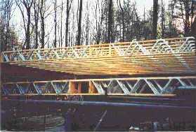 log home construction, floor joists placed