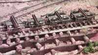 A short rake of disconnect log cars in the yard at Broughton Vale. The ones at left are based on Micro trains Archbar trucks, the ones at right are ex-Bemo HOm trucks that have been "narrow gauged"