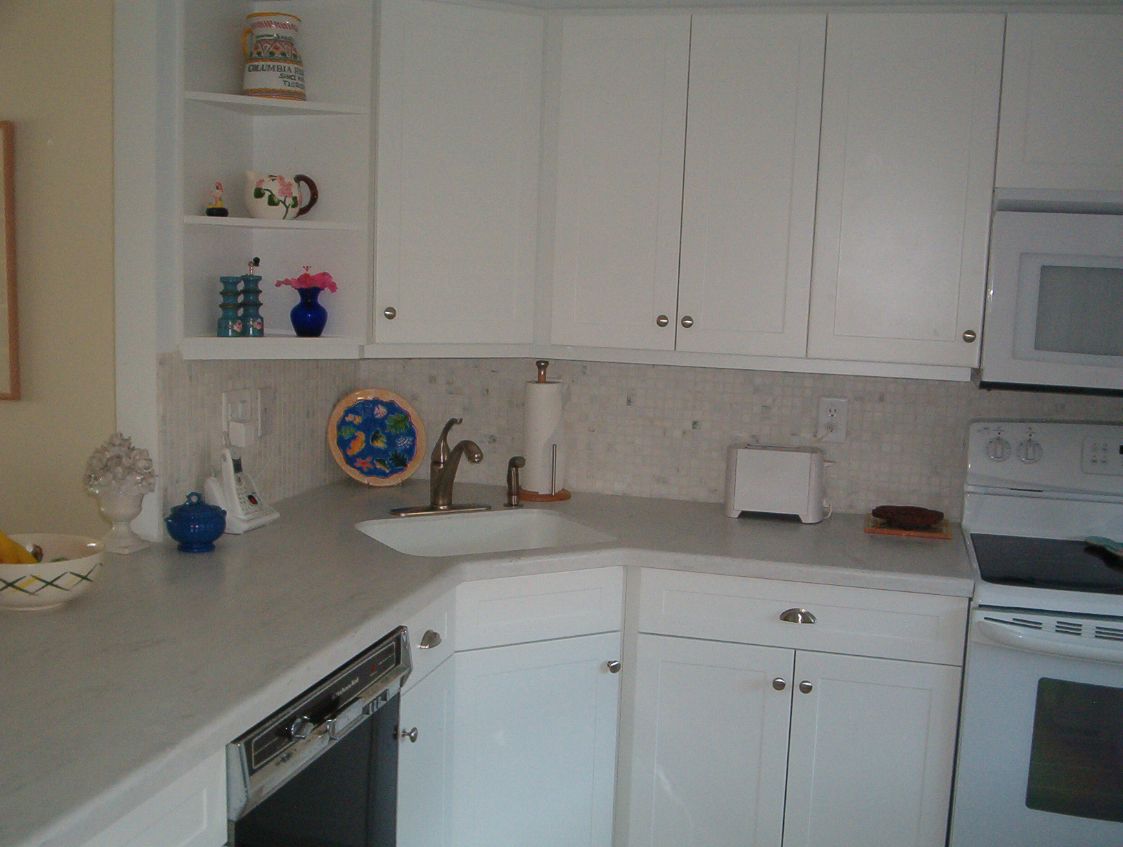New smooth-top stove, microwave, fridge. Corian counters & sink.