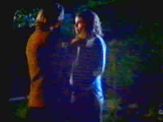 Dimitri zips up Grace's jacket.