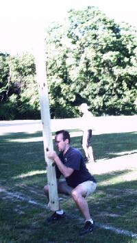 Pher tosses the caber