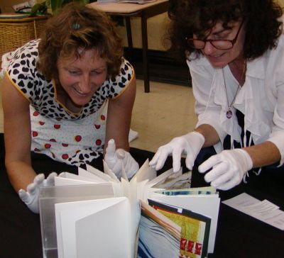 Visitors to the Fair enjoy examining Lost and Found Artists Book