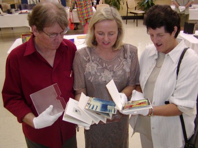 Artists Wim de Vos and Helen Sanderson explain the Lost and Found Artists Book to Webmaster Judy Smith