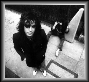 Syd Barrett with his flatmate Iggy photographed by Mick Rock in 1969.