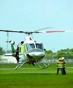 Air Rescue One lifting off from a remote LZ.