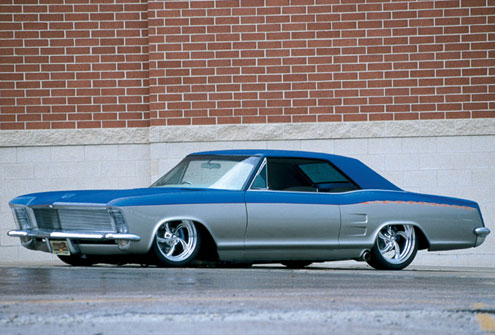 1963 Buick Riviera lowrider with chrome wheels and custom paint
