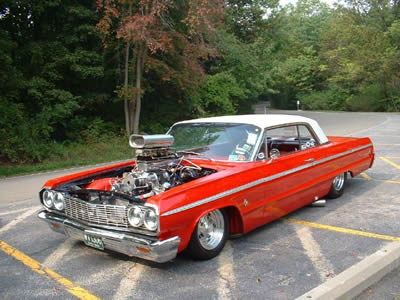 1964 Chevy Impala lowrider with side exhaust and HUGE intake