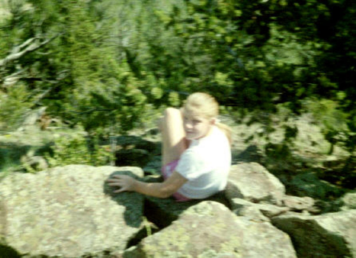 Alexis high on a rock in Colorado on summer vacation 2003
