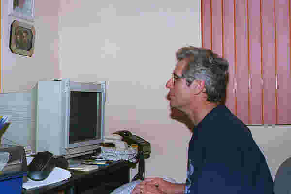 Photo of instructor Richard Gordon working at his computer.