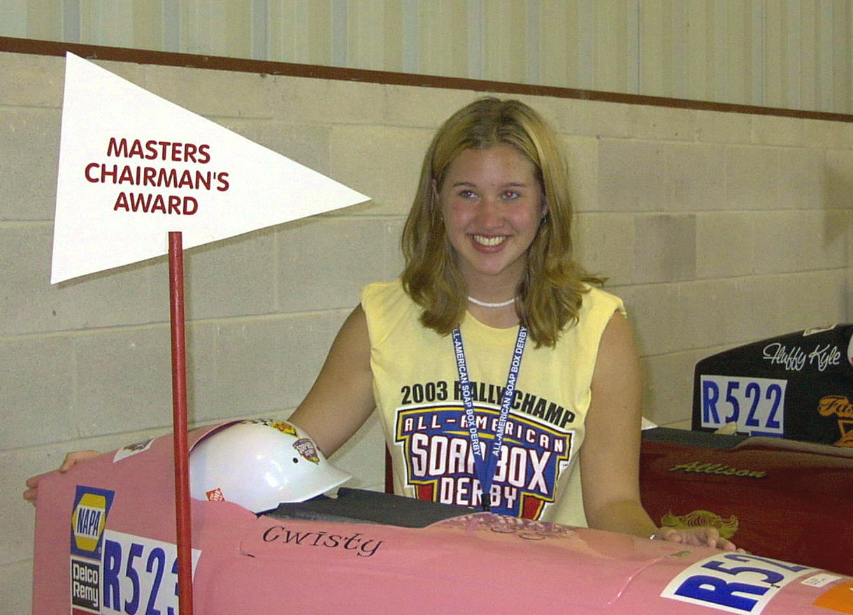 Christy Boelter poses next ot her car, prepared for racing the next day