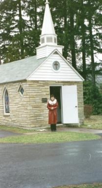 Bernie in front of smallest church.