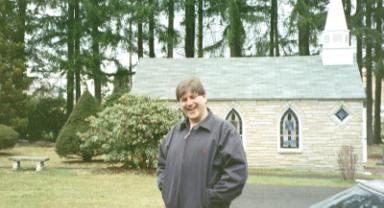 Luigi in front of smallest church.
