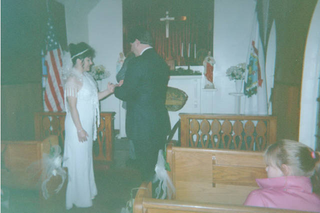 Luigi places the ring on Bernie's finger