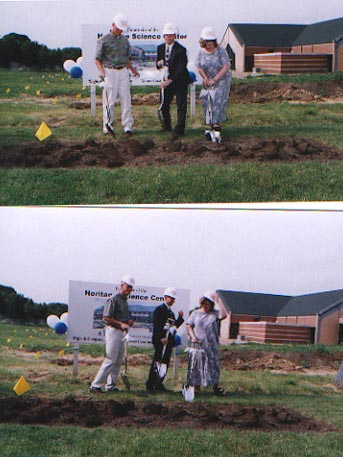 My in a black suit (middle) at the ground breaking for our new science bldg