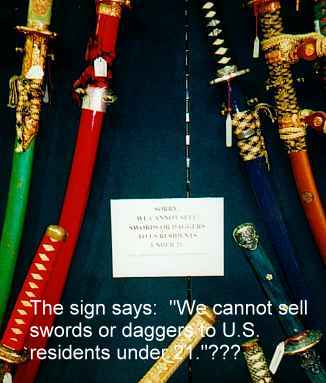 The sign says 'Sorry, we cannot sell swords...to U.S. residents under 21 years of age' ... but we can sell to any teenage psychopathic killers planning to visit the U.S.???