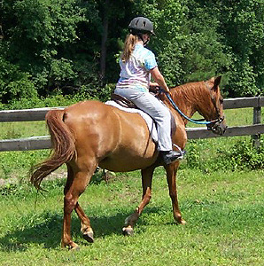 Youth rider with helmet