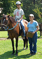 Courtney, a student on Insignia de Gracia receiving instruction from Lynn Gallup
