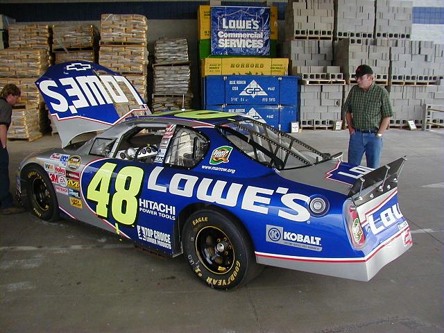 This is the left side of the cutaway car. Looks pretty normal doesn't it? I like the plexiglass hood though. That's a cool touch. Standing on this side of the car will rattle your eye teeth! And yes, that is my dad off to the right.