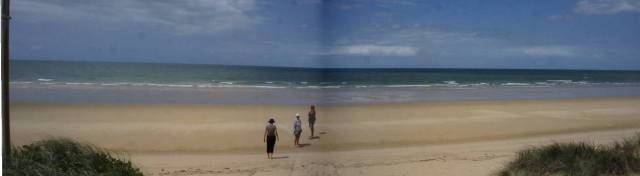 A three picture pan of the beach and crew