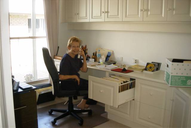 Marghe works at her newly completed office desk.