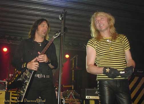 Robert Sweet on left wearing the Black and Yellow 777 Aguppywear logo pendant