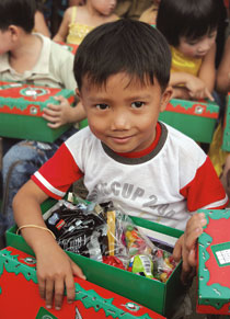 Child with shoe box