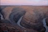 Canyons by flowing river.