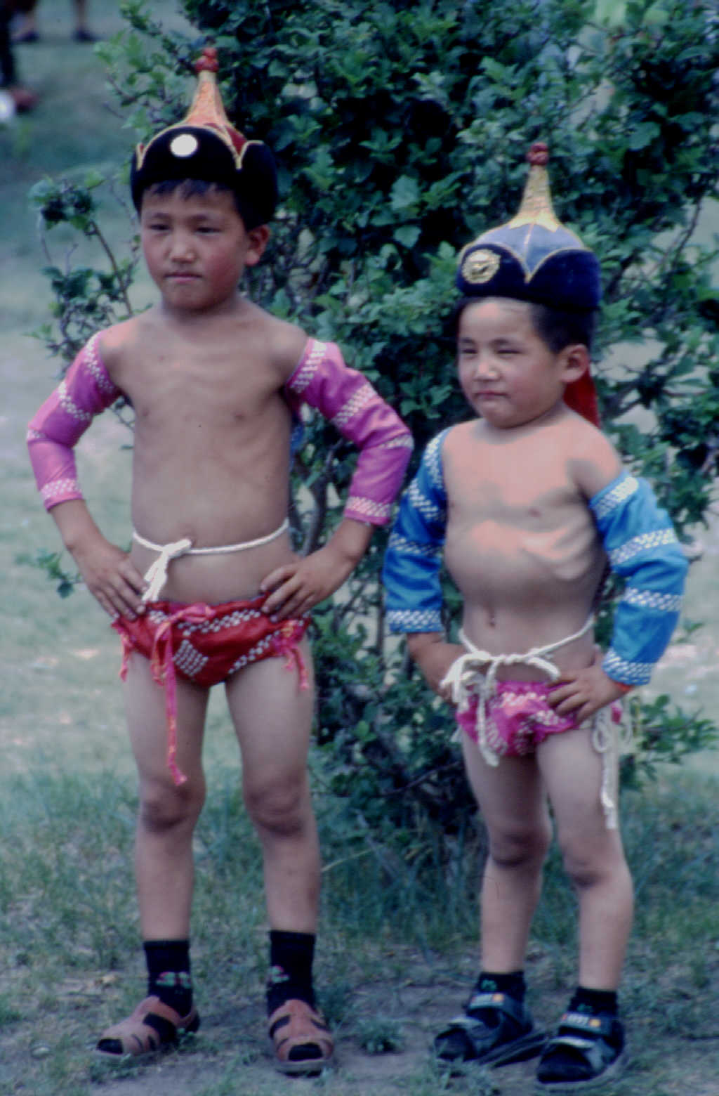 Children in wrestlers' costumes at the Naadam festival, Ulaan Batur