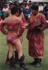Wrestlers and referee at the Naadam festival