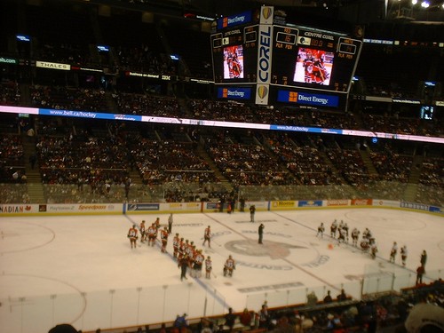 hehe,Captain Daniel Alfredsson (in white team) gave the red team the cup, the red team threw one of the pilons to the white side in return