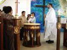 At the baptismal font