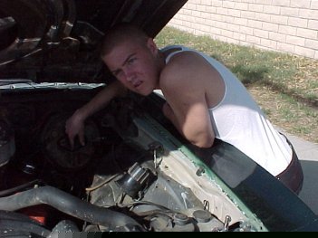 [Chuck and his '71 Malibu, under the hood]
