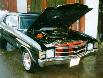 [Front-right side view, open hood.]