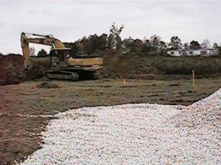 Digging a hole (The gravel is our driveway)